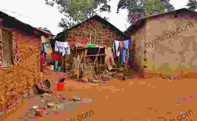 A Group Of People Walking In A Rural African Village, With Houses And Trees In The Background Why Africa Is Poor: And What Africans Can Do About It