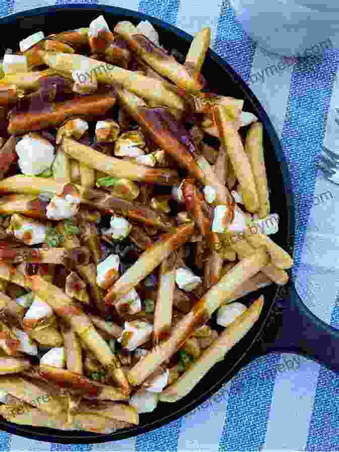 A Plate Of Poutine, A Classic Canadian Dish Of Fries, Gravy, And Cheese Curds EAT LIKE A LOCAL CANADA: Canada Food Guide