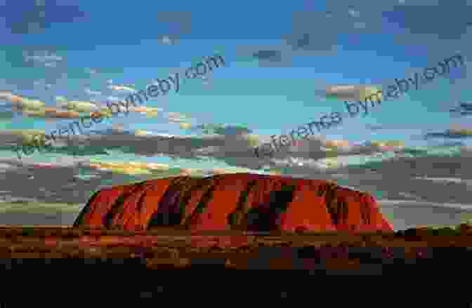 Panoramic View Of The Iconic Uluru (Ayers Rock) In The Vast, Desolate Australian Outback The Jacaranda Trail: A Journey Of Discovery Down Under (Travels Down Under 1)