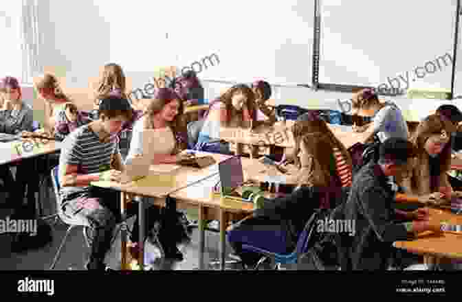 Students Sitting At Desks With Books And Laptops, Working On School Assignments How To Plan Complete School Assignments: Step By Step Study Skills